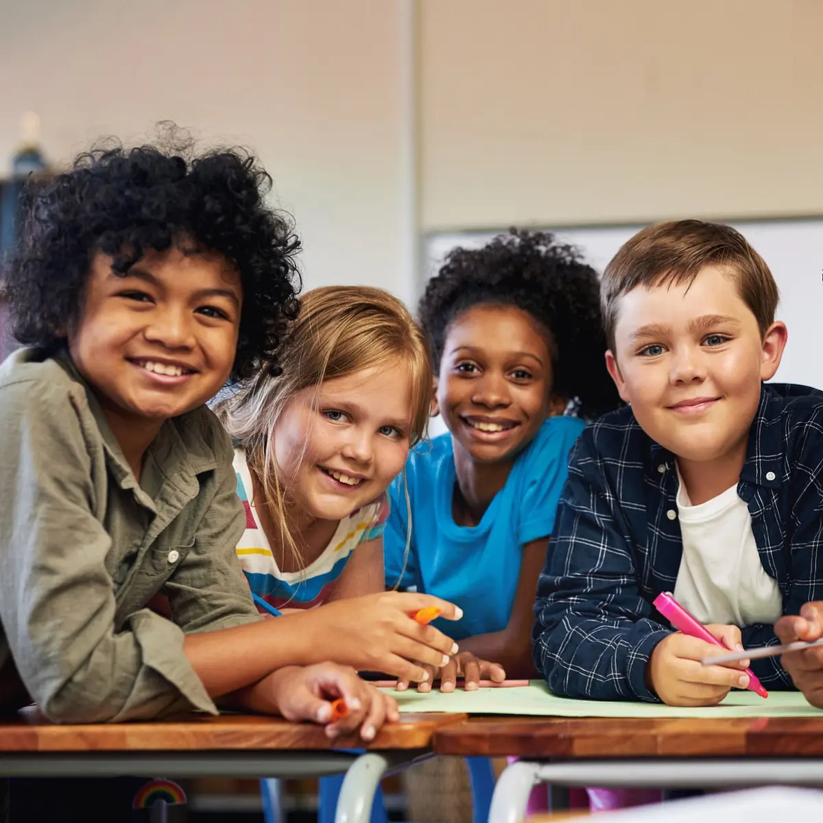 A cheerful group of children smiling.